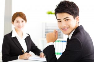 happy business man and woman working  in office